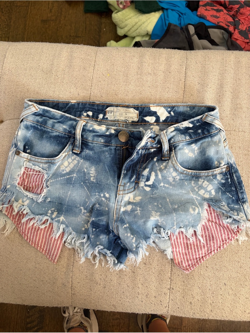 Free People Blue Tie-Dye Distressed Denim Shorts with Red Striped Patch